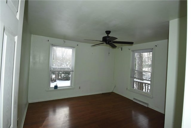 spare room featuring ceiling fan and dark hardwood / wood-style flooring