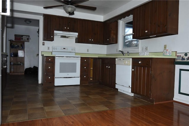 kitchen featuring dark brown cabinetry, ceiling fan, and white appliances