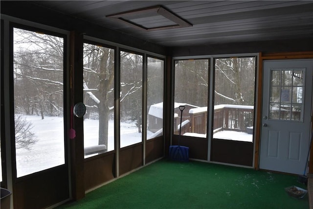 unfurnished sunroom with wood ceiling