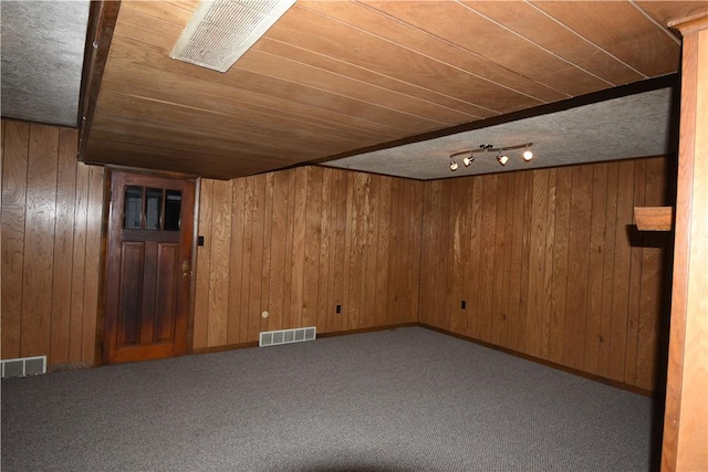 additional living space featuring carpet flooring, wood walls, and wood ceiling