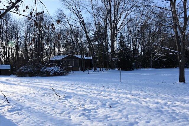 view of yard layered in snow