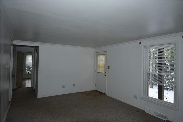 carpeted empty room featuring ornamental molding