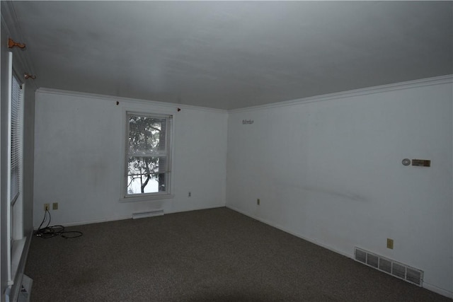 carpeted spare room featuring ornamental molding