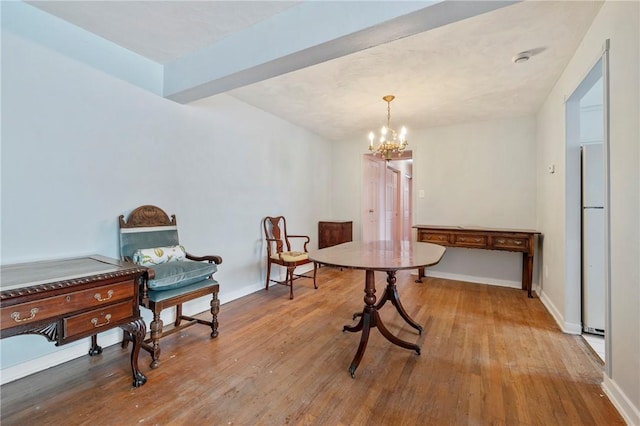 dining area featuring hardwood / wood-style flooring, beamed ceiling, and a notable chandelier