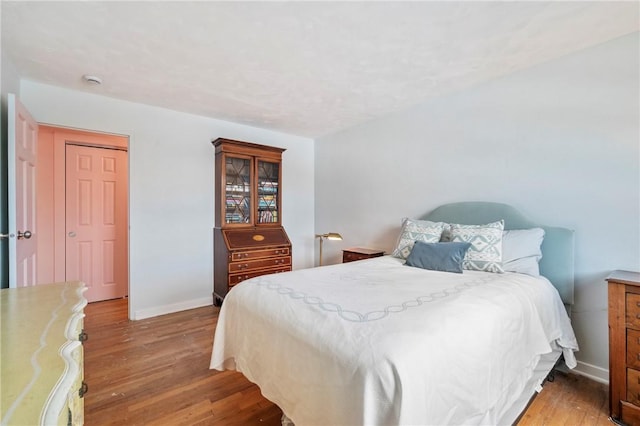 bedroom with hardwood / wood-style flooring