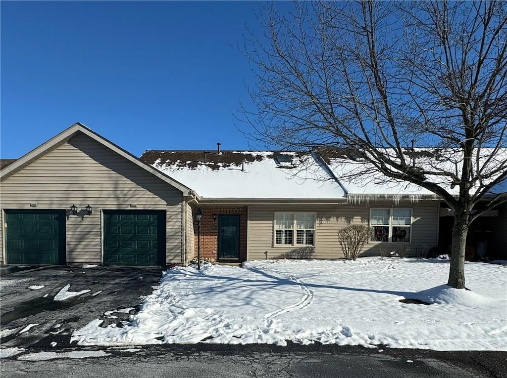 single story home with a garage