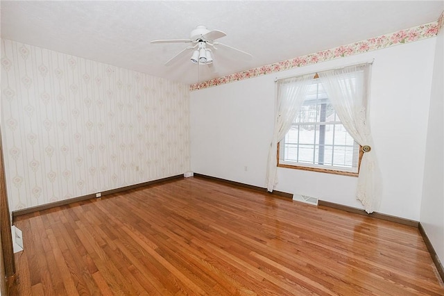 unfurnished room featuring ceiling fan and light hardwood / wood-style floors