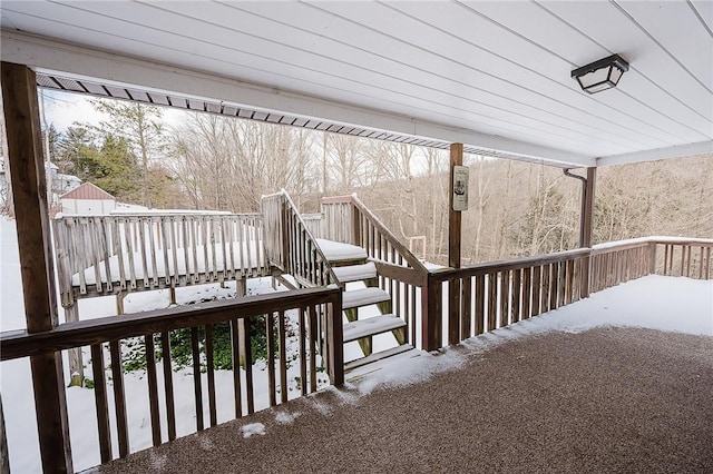 view of snow covered deck