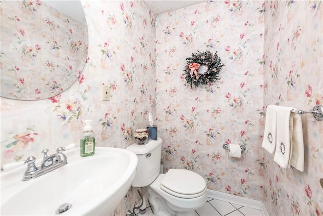 bathroom featuring tile patterned floors, sink, and toilet