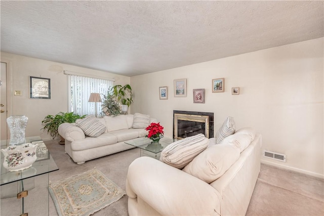 living room with light colored carpet and a textured ceiling