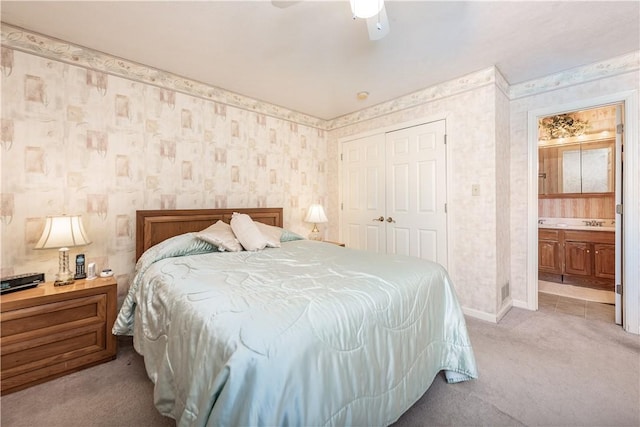 carpeted bedroom featuring ceiling fan and a closet