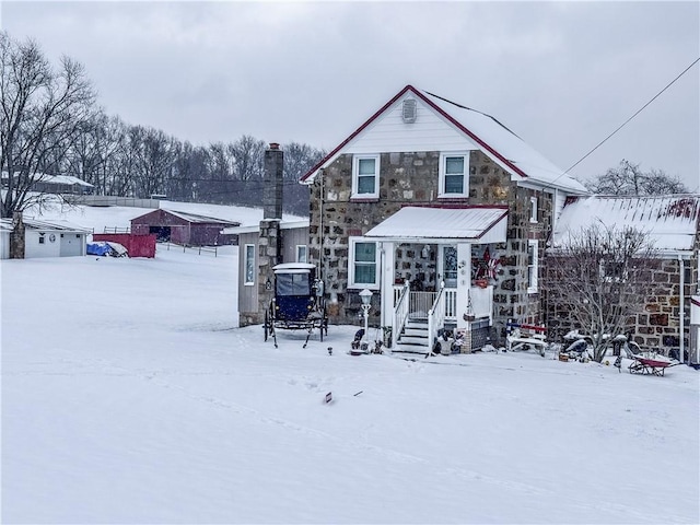 view of snow covered house