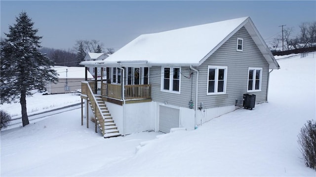 exterior space featuring central AC and a garage