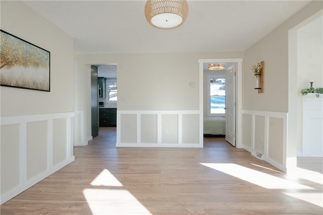 spare room with light wood-type flooring