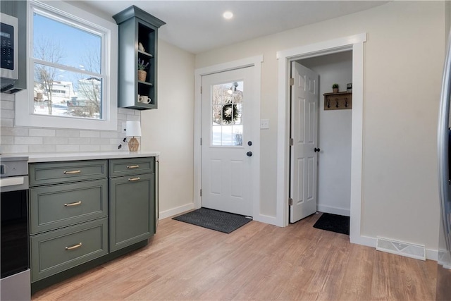 entryway with light hardwood / wood-style floors