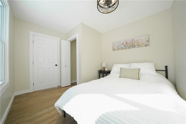 bedroom with hardwood / wood-style floors