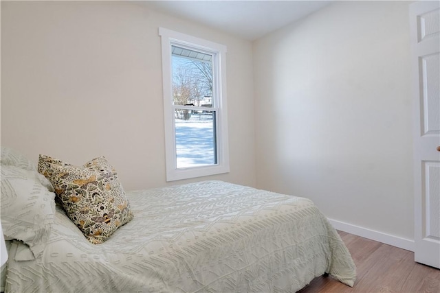 bedroom with hardwood / wood-style flooring