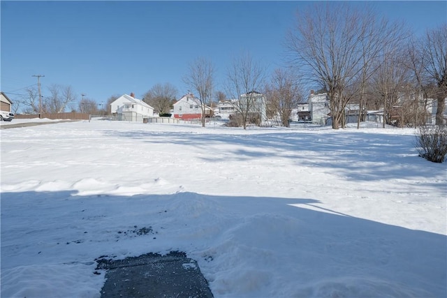 view of yard layered in snow