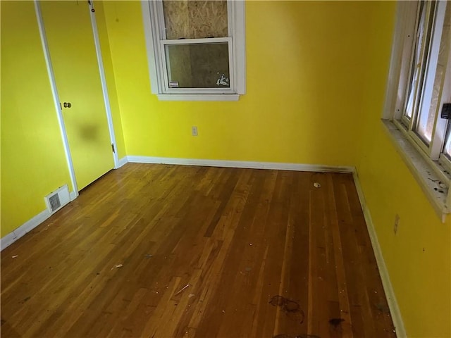 empty room with wood-type flooring