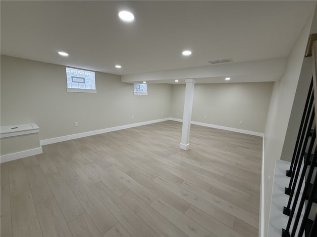 basement featuring light hardwood / wood-style flooring