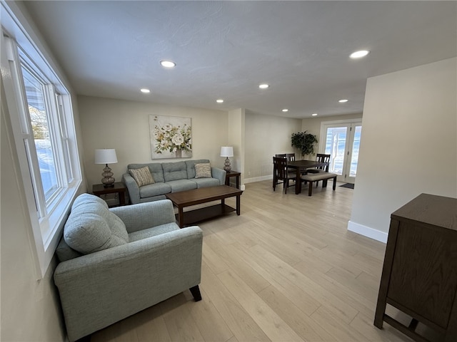 living room with light hardwood / wood-style floors