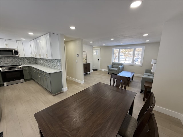 dining space featuring light wood-type flooring