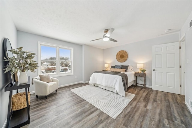 bedroom featuring ceiling fan and dark hardwood / wood-style flooring