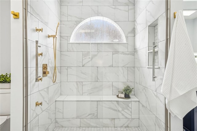 bathroom featuring a shower with shower door