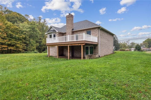 back of property featuring a lawn and a deck