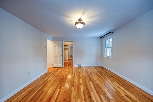 unfurnished room featuring light hardwood / wood-style flooring