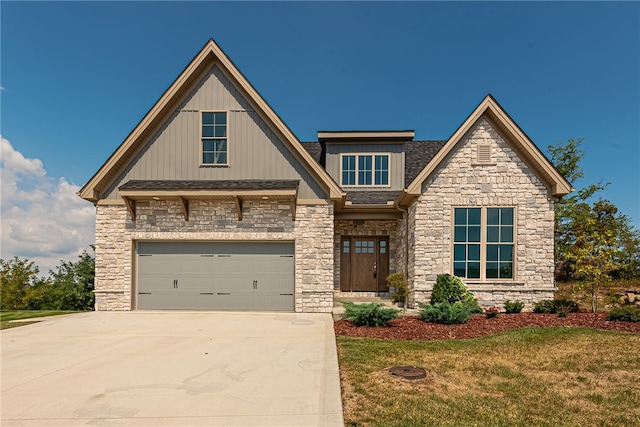 view of front facade with a garage and a front lawn