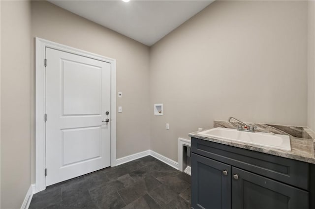 laundry room featuring cabinets, washer hookup, and sink