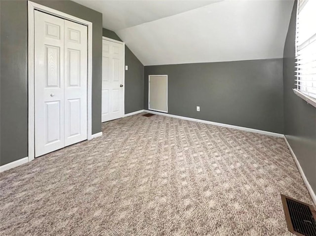 bonus room featuring carpet and lofted ceiling