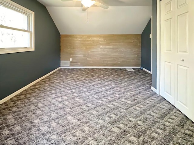 bonus room with ceiling fan, carpet floors, and lofted ceiling