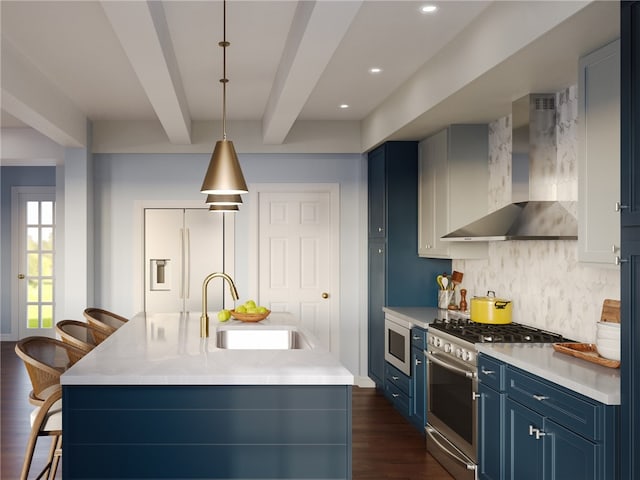 kitchen with sink, blue cabinetry, appliances with stainless steel finishes, tasteful backsplash, and wall chimney exhaust hood