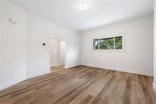 spare room with hardwood / wood-style flooring