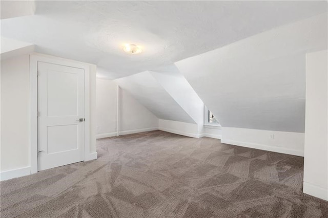 bonus room featuring carpet and lofted ceiling