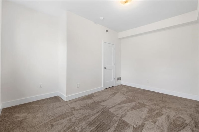 empty room with carpet flooring