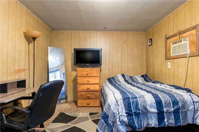 bedroom featuring an AC wall unit and wood walls