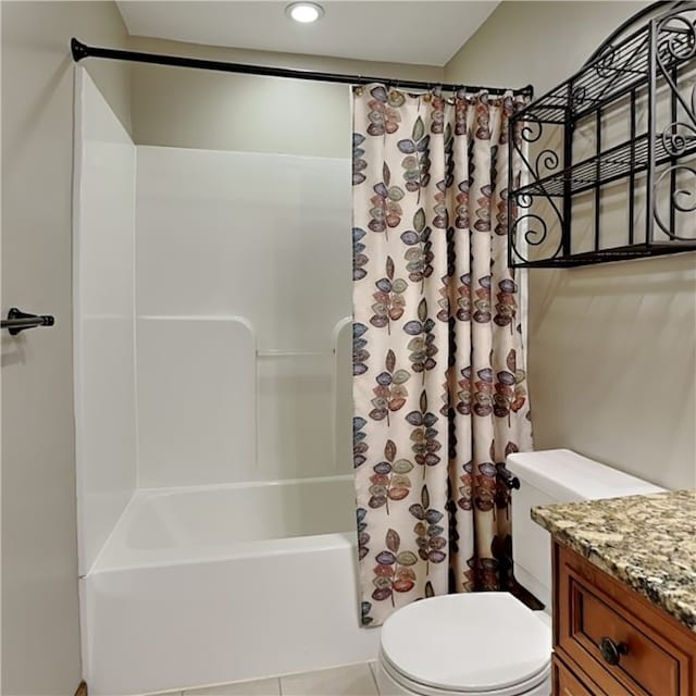 full bathroom featuring shower / bath combination with curtain, vanity, toilet, and tile patterned floors