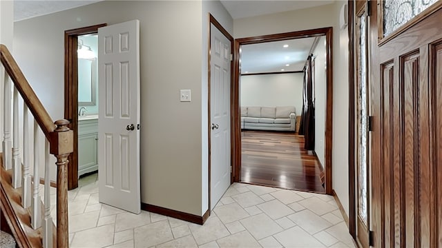 corridor with light tile patterned flooring