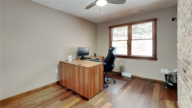 office area featuring hardwood / wood-style floors and ceiling fan