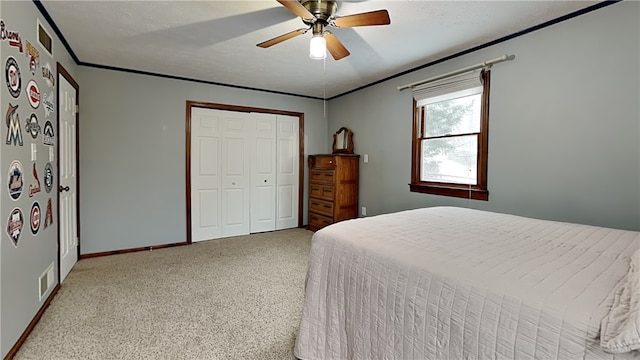 bedroom with ceiling fan, a closet, and carpet floors