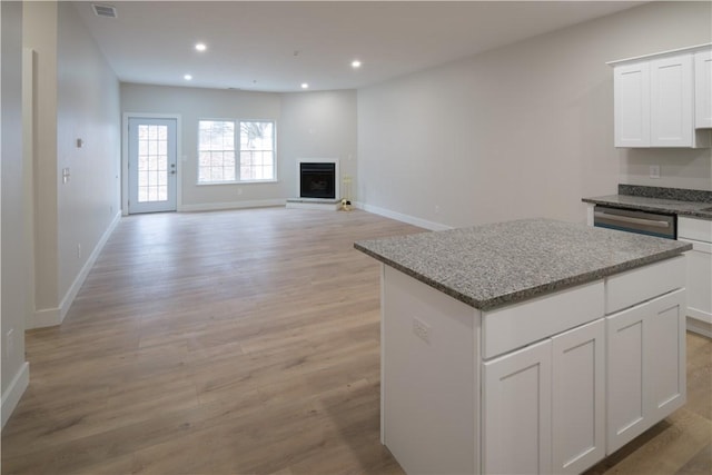 kitchen with recessed lighting, visible vents, a kitchen island, and dishwasher