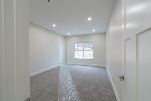 unfurnished room featuring recessed lighting, carpet flooring, and baseboards