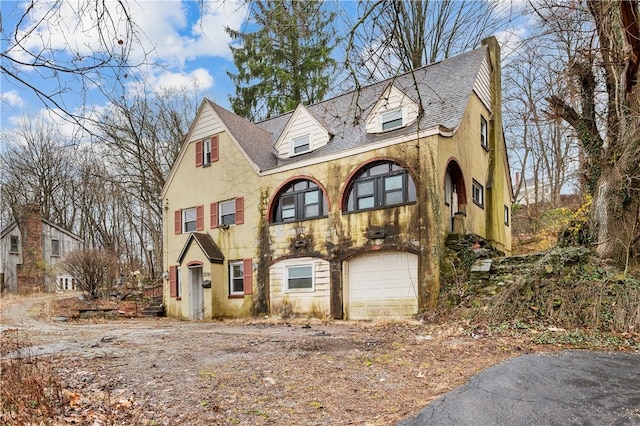 view of front of property with a garage