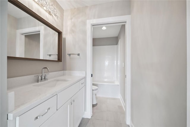 bathroom featuring tile patterned flooring, vanity, and toilet