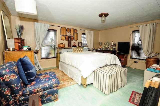 bedroom featuring light hardwood / wood-style floors and multiple windows