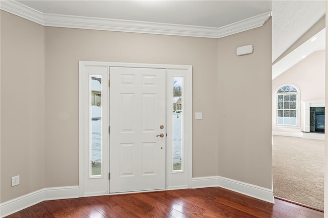 foyer featuring hardwood / wood-style flooring, plenty of natural light, and ornamental molding