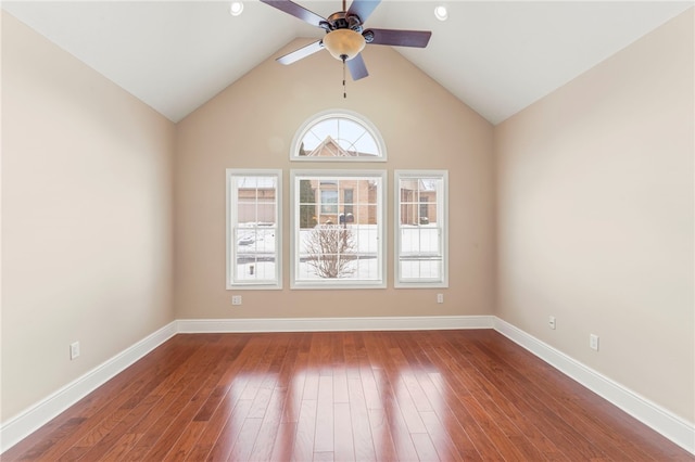 spare room with ceiling fan, wood-type flooring, and lofted ceiling